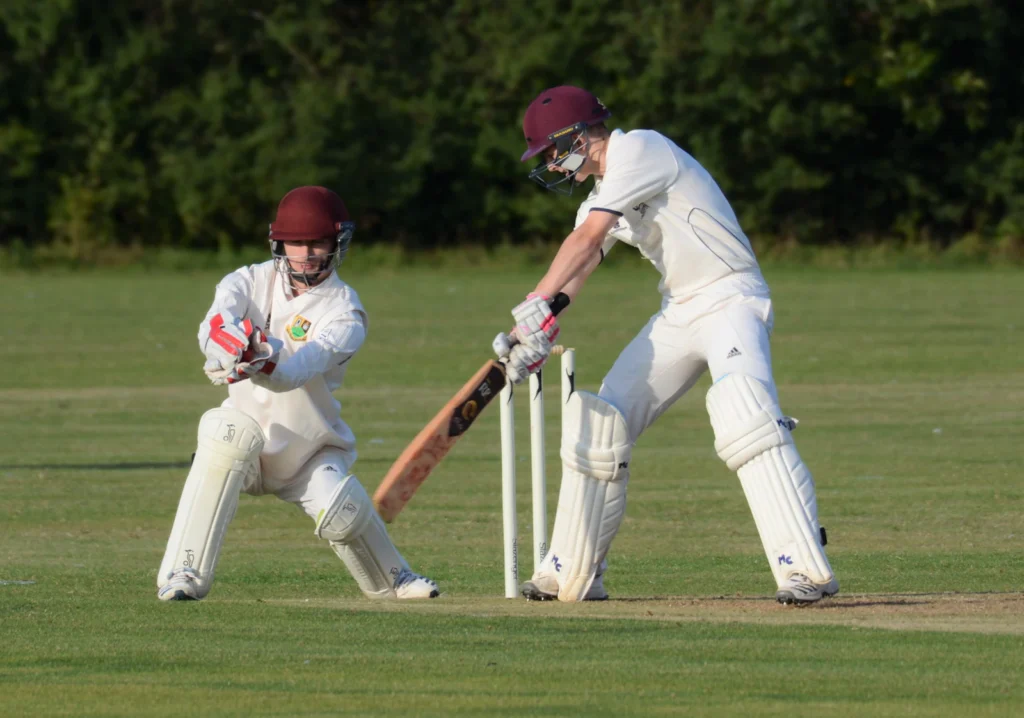 Batter and wicketkeeper in a club match