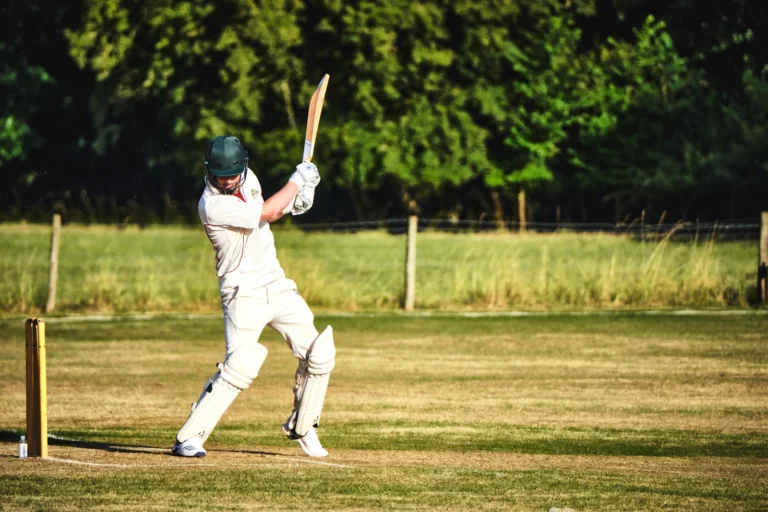Club cricketer lifting his bat to play a shot
